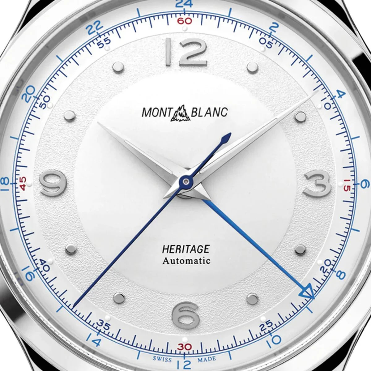 Close-up of luxury silver Montblanc Heritage automatic watch with blue accents and textured dial