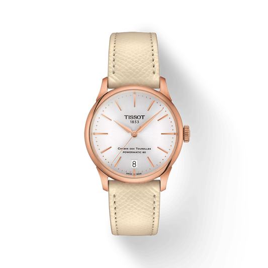 Rose gold dress watch with white leather strap, white dial, and date display