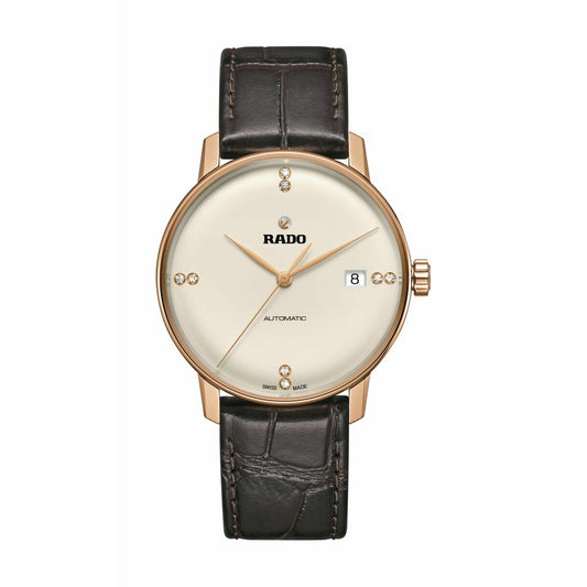 Elegant Rado gold automatic watch with diamond markers, date window, and brown leather strap