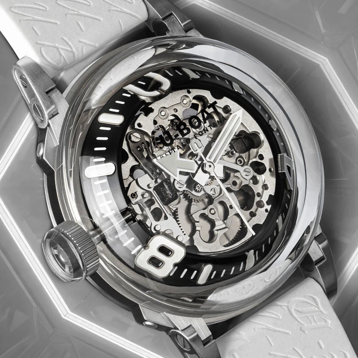Skeleton dial luxury watch with silver case, visible gears, bold numeral detail, and white strap