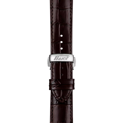 Brown leather watch strap with silver buckle and textured alligator pattern