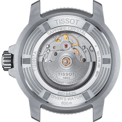 Close-up of Tissot diver's watch caseback showing sapphire crystal and automatic movement