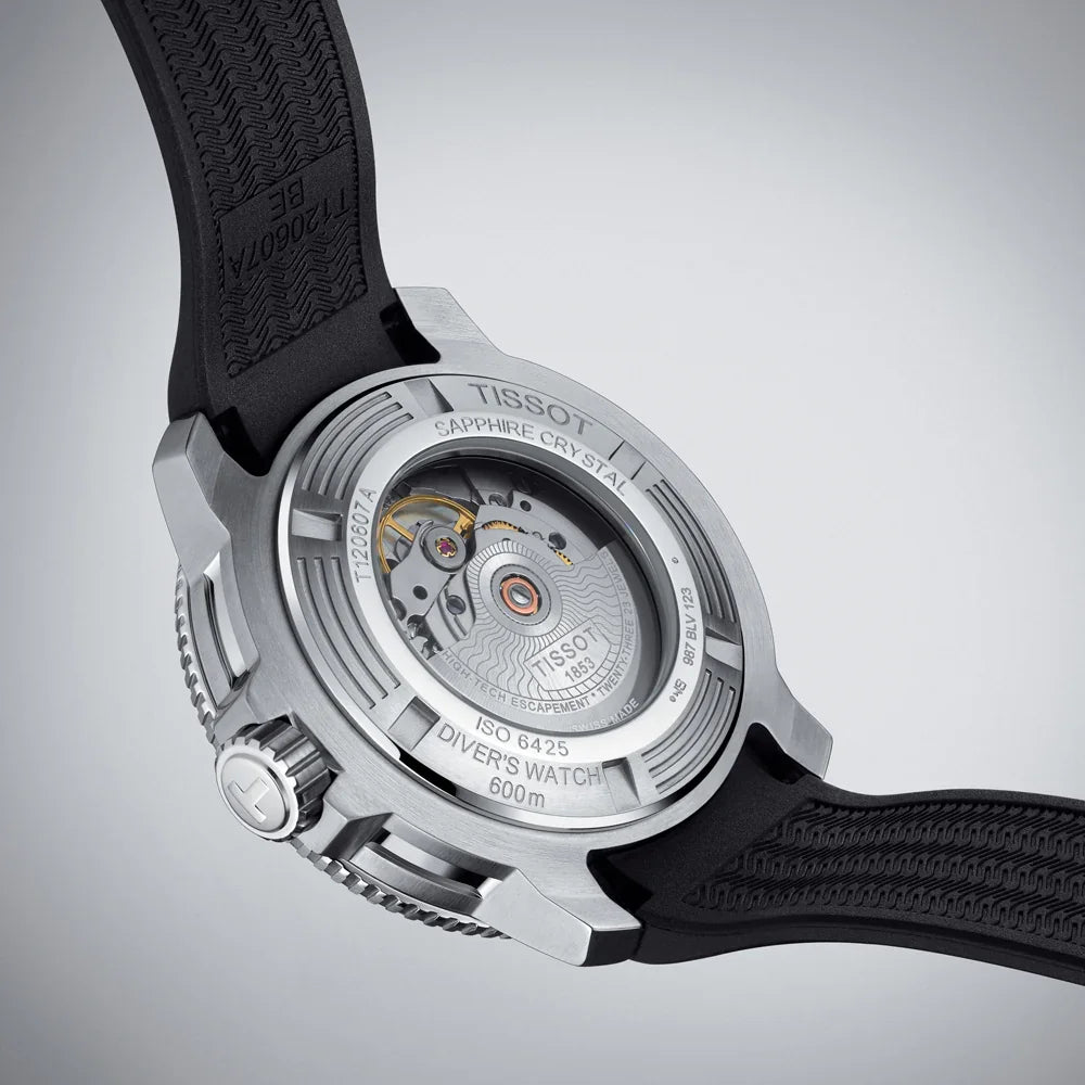Automatic diver's watch back view with visible movement, black strap, and sapphire crystal