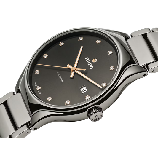 Luxury automatic wristwatch with black dial, diamond hour markers, and stainless steel band