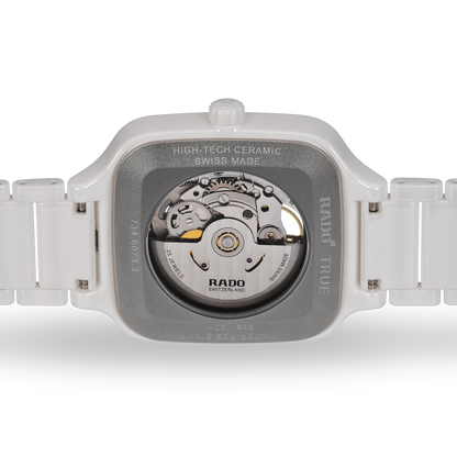 White ceramic Swiss automatic watch back with exposed movement and metal caseback
