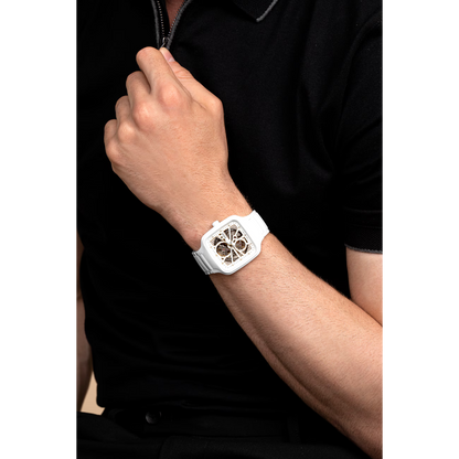 White square skeleton watch with openwork dial on wrist, modern luxury timepiece.